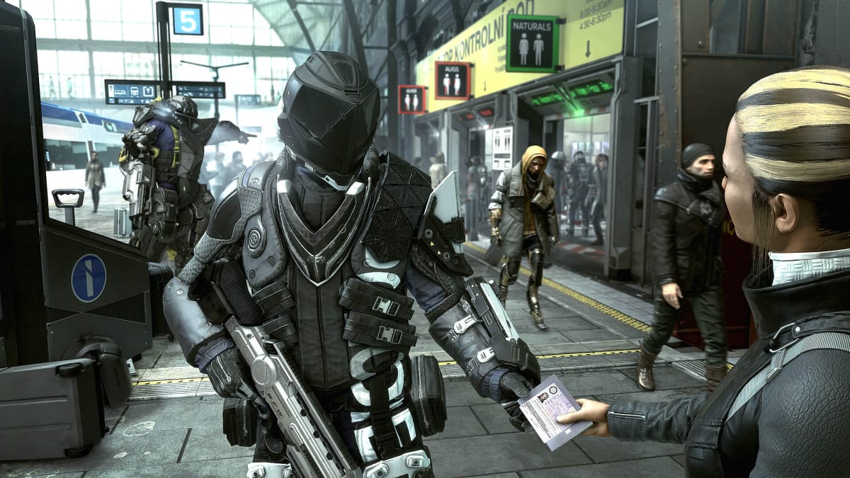 A guard checking a citizen's passport in Deus Ex: Mankind Divided, one of April 2018's Humble Monthly games