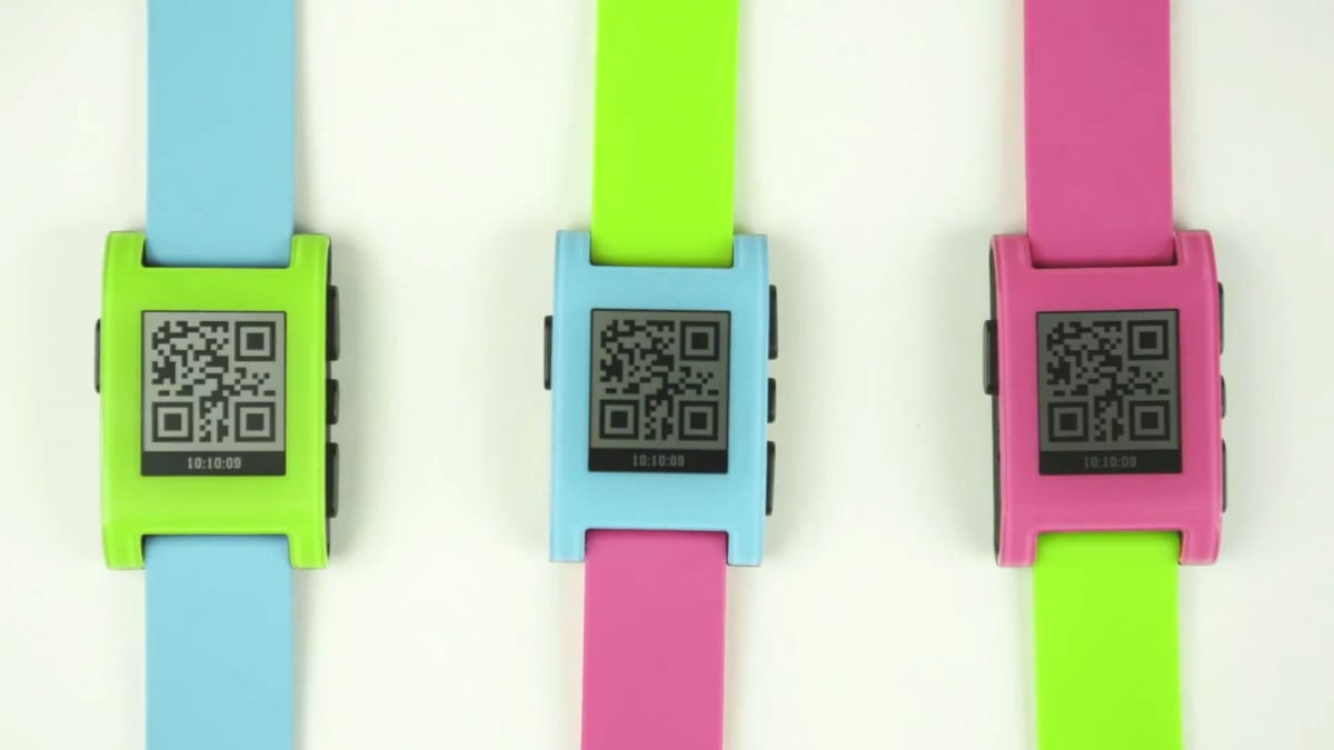 Three Pebble smartwatches in different colors