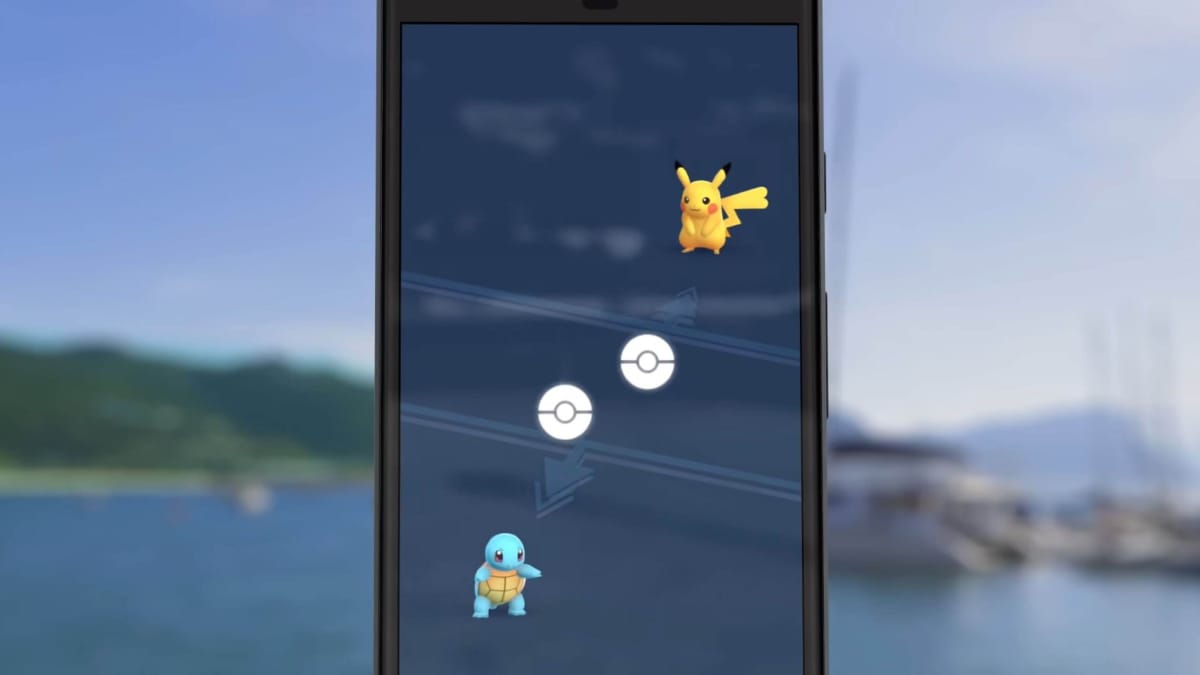 A smartphone showing a Pikachu and a Squirtle being traded in Pokemon Go