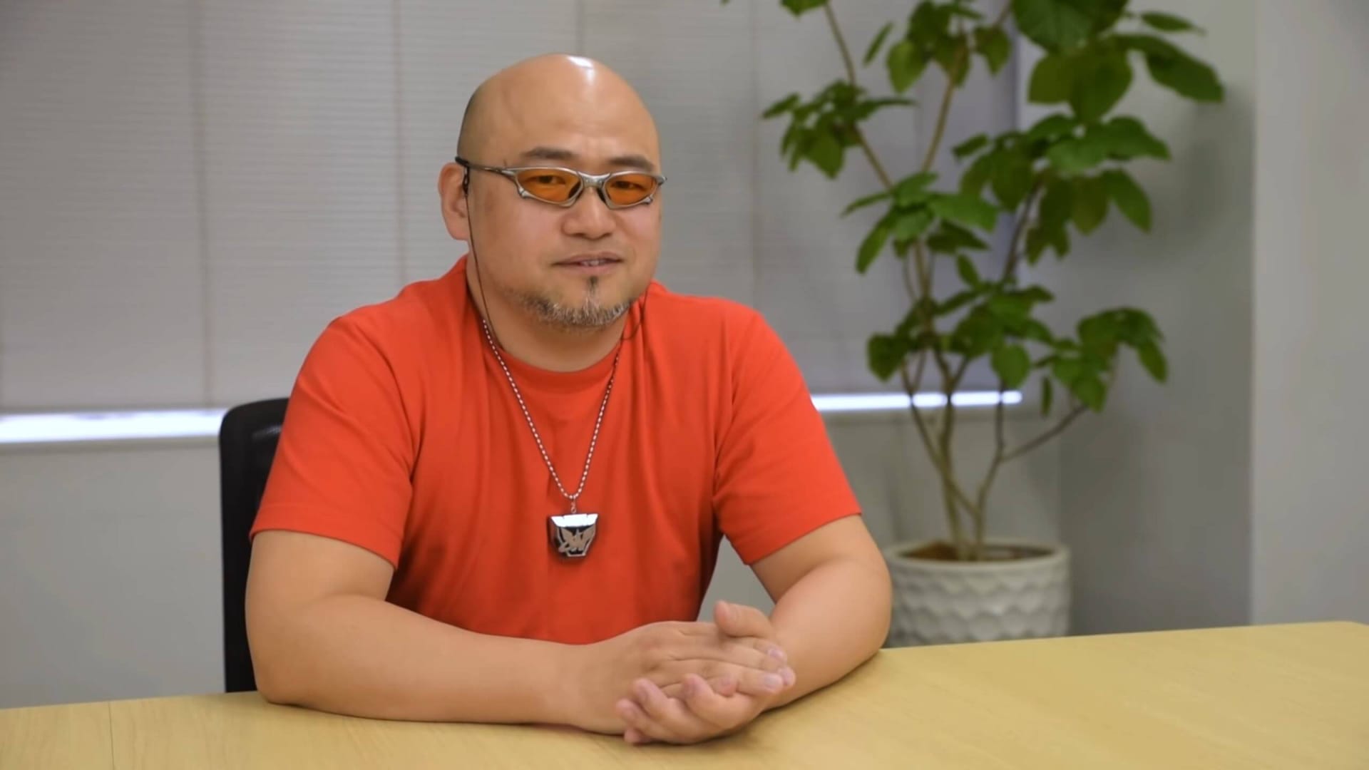 Hideki Kamiya smiling at the camera in an interview about PlatinumGames title The Wonderful 101