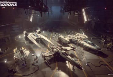 The image of a hangar with four spaceships in it