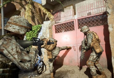 Marines kicking down a door in Six Days in Fallujah