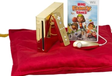 A press release photo of Queen Elizabeth's golden Wii, complete with golden Wiimote and nunchuck.