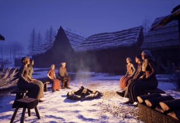 A group of villagers sitting around a wintry campfire in Medieval Dynasty