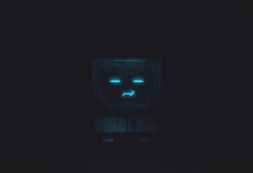 The glowing face of a robot in a dark factory