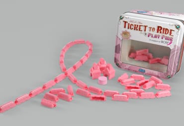 The pink train pieces seen in Ticket to Ride: Play Pink laid out in a distinct ribbon pattern