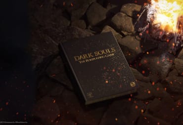 The Collector's Edition of the Dark Souls tabletop RPG next to a bonfire