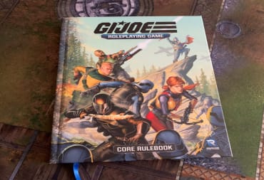 A hardcover copy of GI Joe: The Roleplaying Game on a mat table