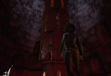 Emem staring at a tall stone tower in a large cavern