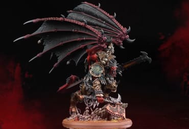 The Daemon Primarch Angron 40k model on a dark background