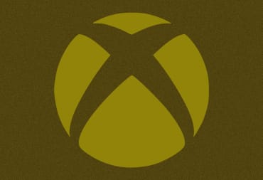A golden Xbox logo against a golden backdrop