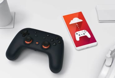 A Google Stadia controller next to a phone depicting a cloud gaming connection process