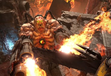 The player about to chainsaw a Mancubus in the face in Doom Eternal