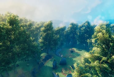 Screenshot of the Valheim Meadows Biome, where we see stunning trees, a stone structure and blue skies