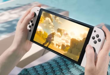 A woman playing the Nintendo Switch poolside