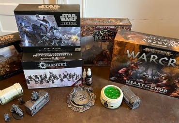 A pile of gifts featured in our wargaming gift guide including warcry heart of ghur and more