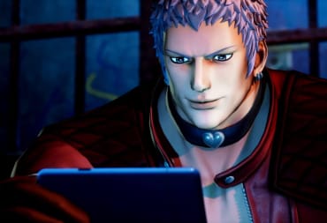 Yashiro smiling as he looks at his phone in King of Fighters XV
