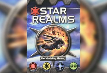 Star Realms Card Game Cover Showing a Space Ship Blasting Through a Circle Symbol that appears to be on fire, while the background is mostly devoted to a random planet. 