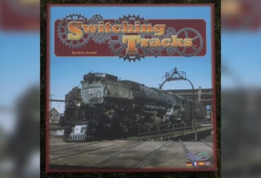 Switching Tracks Game Cover depicting a turn-of-the-century steam engine in a rural desert-esque location, with a wooden sign towards the top that displays the game's name. 