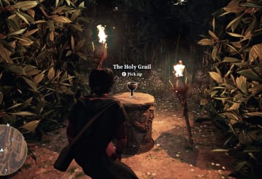 The player crouching in front of the Holy Grail (yes, really) and being prompted to pick it up in the Bible game Gate Zero