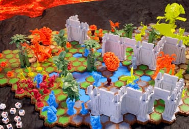 The board game Heroscape, set up on a black tabletop, featuring colorful miniatures and hexagonal grid.