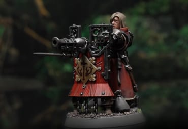 A detailed screenshot of a Freeguild Fusiliers gunner model from the Warhammer: Age of Sigmar Cities of Sigmar army, showing a blonde woman behind cannon-mounted pavis.