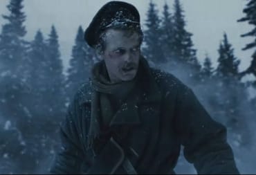 A soldier looking scared in a snowy forest in The War of the Worlds: Siberia