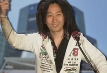 Tak Fujii can be seen with an image of E3's convention centre behind him