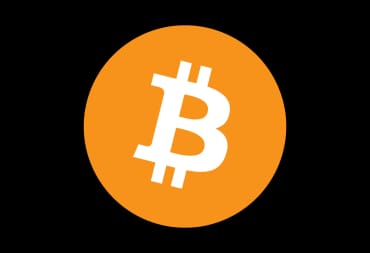 The Bitcoin logo against a black backdrop