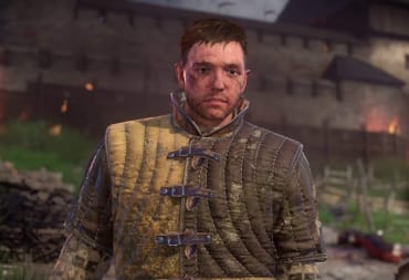 Henry standing in front of a burning village in Kingdom Come: Deliverance
