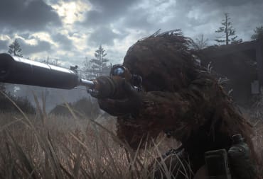 A character in a ghillie suit aiming a sniper rifle in Call of Duty: Modern Warfare Remastered