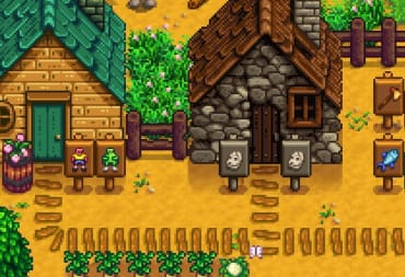 screenshot from Stardew Valley showing several pixelated homes in a rural town. 
